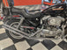 Moto Iron® Upsweep Exhaust System for Harley-Davidson Sportster 1986-2003 shown in chrome with mounting brackets and hardware, ideal for adding custom chopper style. Displayed on a white background.