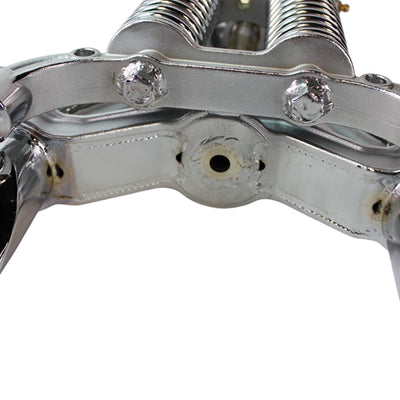 A close up image of a Vintage Springer Front End Stock Length Chrome fits Harley Davidson by Moto Iron® chrome cylinder head with bolt-on installation.