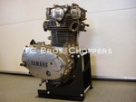 The TC Bros. Engine Stand for 1970-1985 Yamaha XS650 motors features a durable black metal U-shaped frame and two horizontal bars, ideal for securely mounting XS650 engines or similar heavy components.